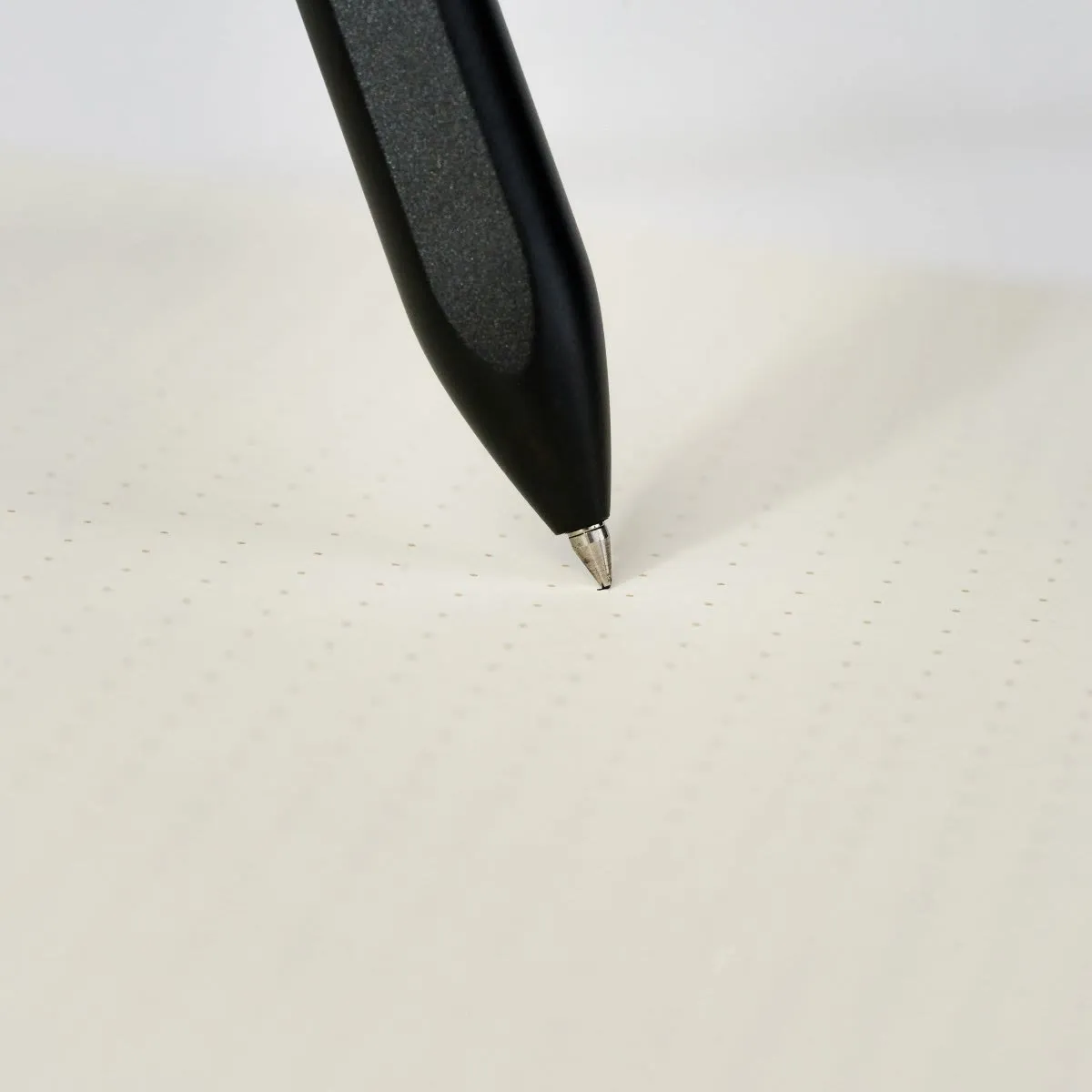 The Blackwing Pen resting on a writer’s notebook.